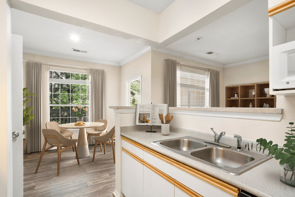 a kitchen and dining area in a 555 waverly unit