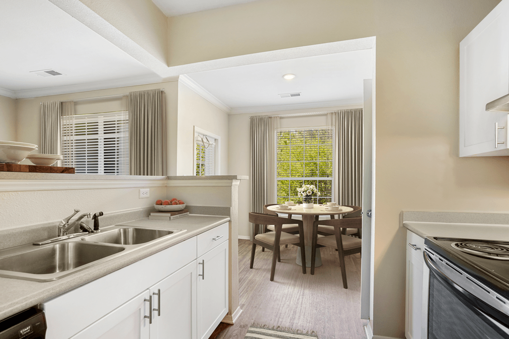 a kitchen and dining area in a 555 waverly unit