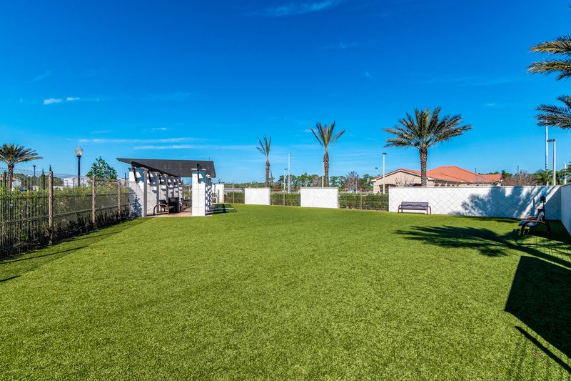 a large backyard with a lawn and a gazebo