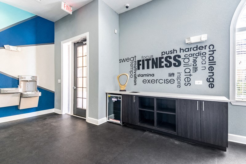 a room with a sink and a wall with words on it