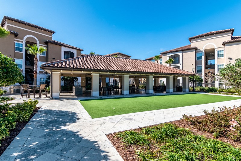 the preserve at ballantyne commons apartments clubhouse with lawn and patio