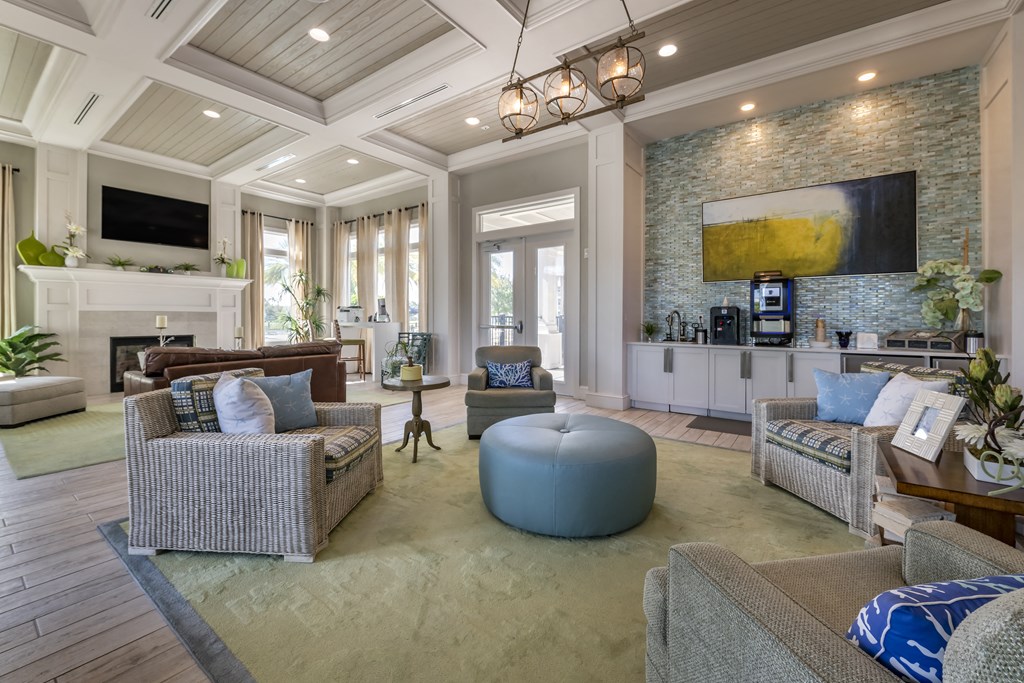 a living room with couches and chairs and a tv