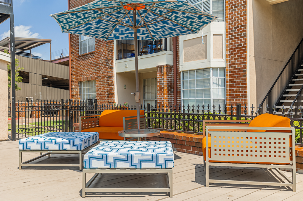 outdoor lounge area with umbrella