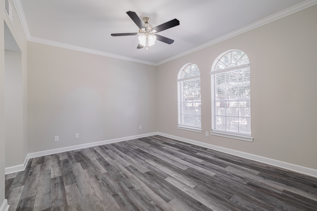 living room with hardwood-style flooring and ceiling fan