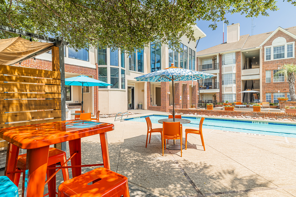 covered tables near swimming pool