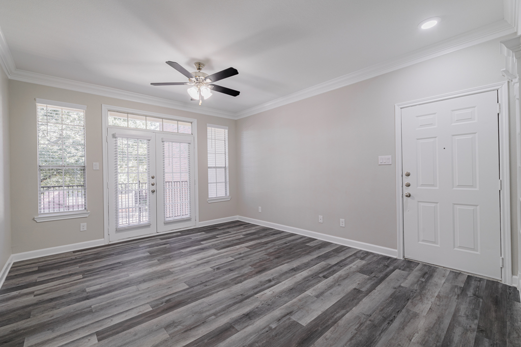 living room with hardwood-style flooring and ceiling fan