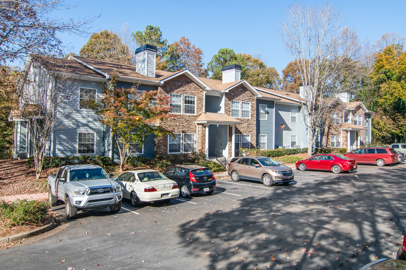 a large house with cars parked in front of it