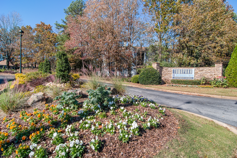 the front yard of a house with a garden and a road