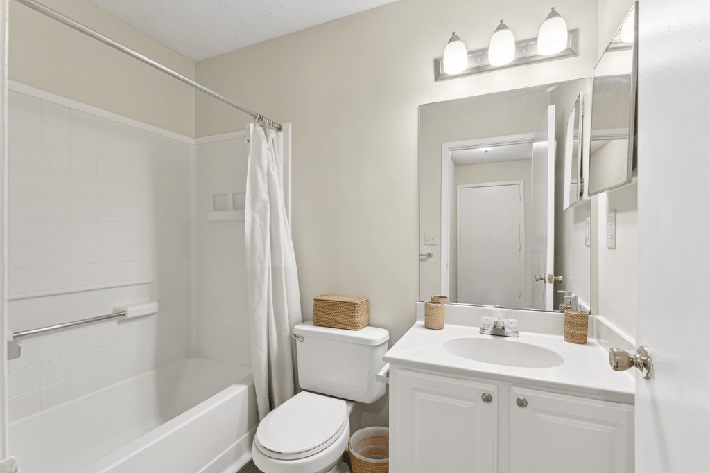 a bathroom with a sink toilet and a shower