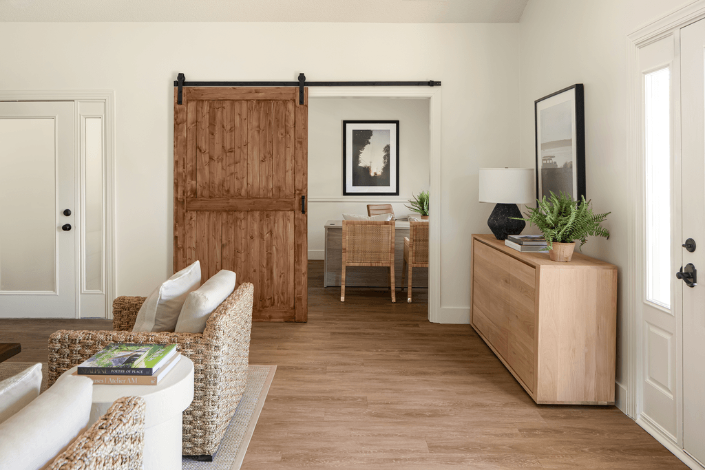 a living room with a sliding barn door