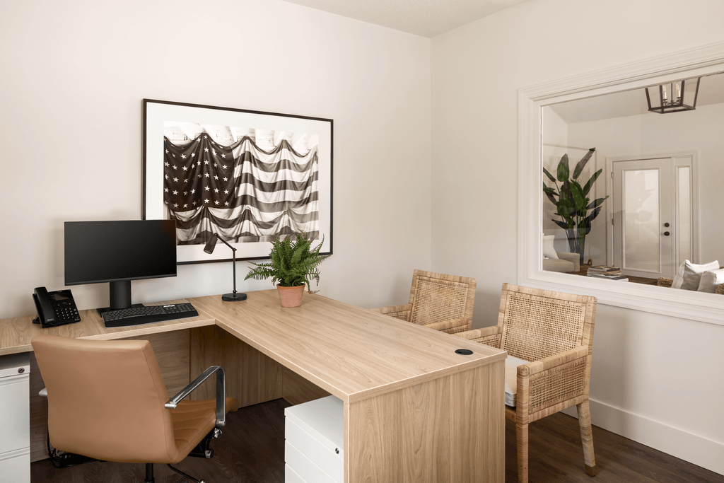 a home office with a desk and a computer