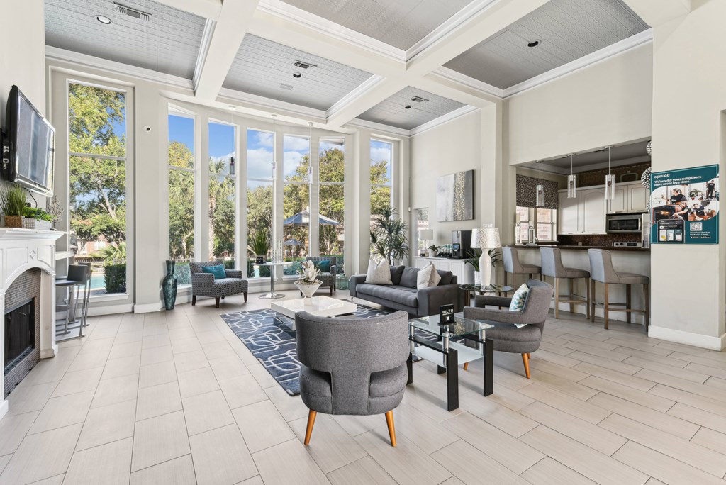 A living room with a fireplace and a television.