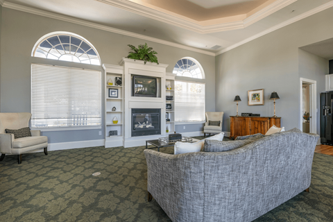 Clubhouse with furniture and a large window