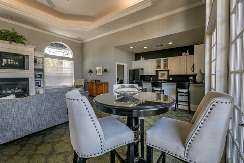 Clubhouse filled with furniture and a large window