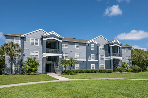 exterior view of an blue 2-story apartment building