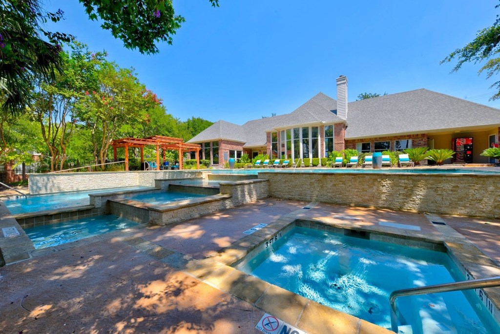 pool and hot tub in front of apartment clubhouse