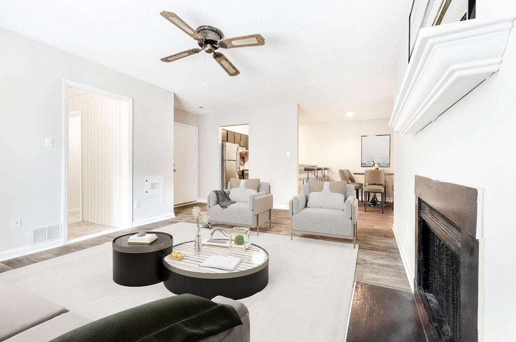 A living room with a fireplace and a couch. at Woodlyn on the Green Apartment Homes, Cary, NC, 27513