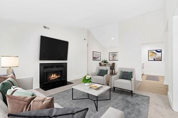 Living Room With Tv And Fireplace at Woodlyn on the Green Apartment Homes, Cary, NC, 27513