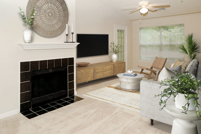 a living room with a fireplace and a flat screen tv