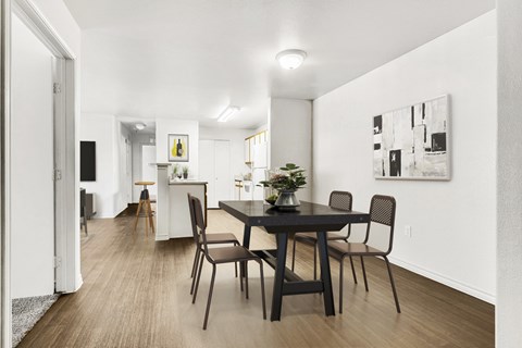 Dining room with black table and modern artwork at Tierra Antigua Apartments, Mesa, AZ 85207