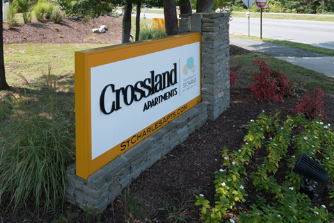 A sign for Crossland Apartments in St. Charles.