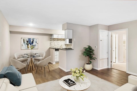 A living room with a dining table and chairs.