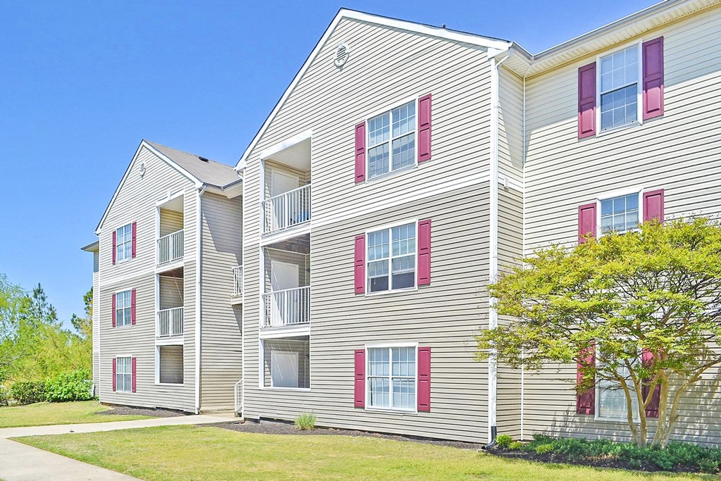 Building Exterior surrounded by shrubbery and trees