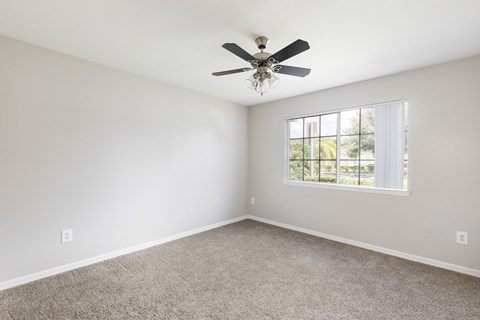 bedroom with carpeted flooring and a ceiling fan