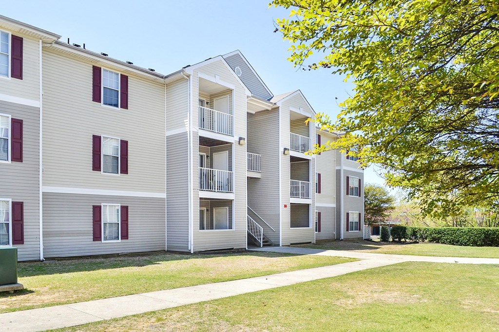 Building Exterior surrounded by shrubbery and trees