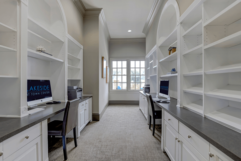 A spacious kitchen with white cabinets and a sign that says "Lakeside at Town Center".