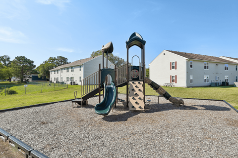 A playground with a green slide