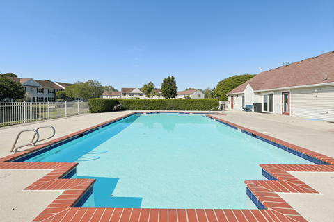 A rectangular pool with a brick border.