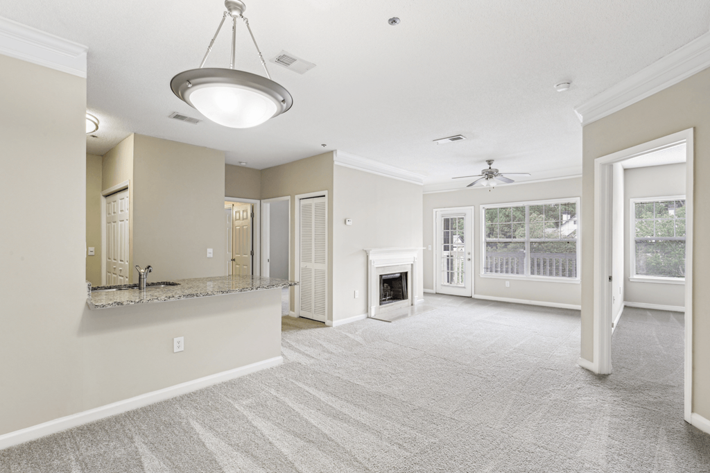 living room with carpeted flooring and fireplace