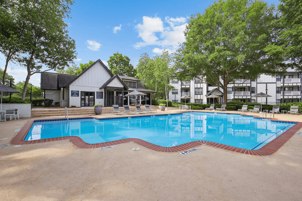 swimming pool with apartment buildings in the background