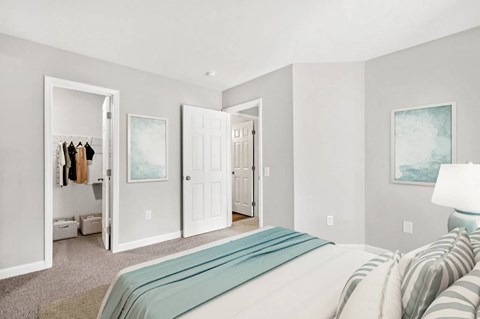 a bedroom with a bed and a closet