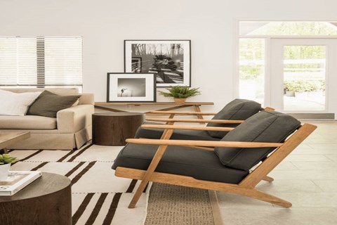 a living room filled with furniture and a large rug