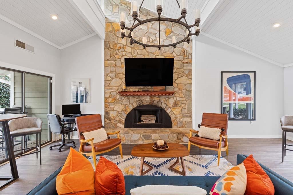 Clubroom With Fireplace And TV at Woodland Park Apartment Homes, Greensboro, 27455
