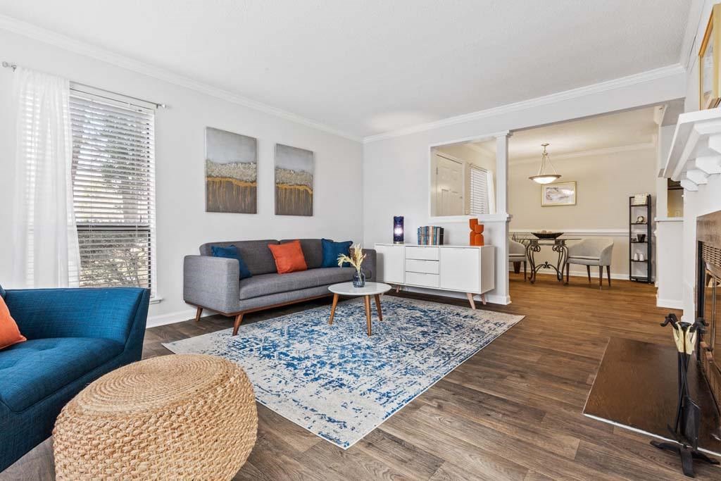Living Room With Kitchen View at Woodland Park Apartment Homes, Greensboro, 27455