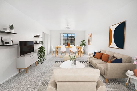A living room with a grey carpet and a large painting on the wall.