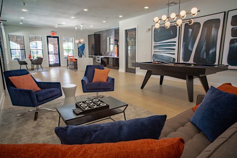 a living room with a piano and couches