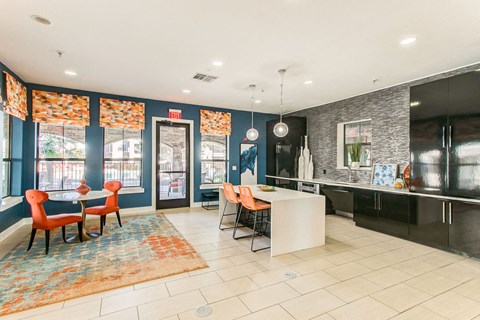 a kitchen and dining room with a table and chairs