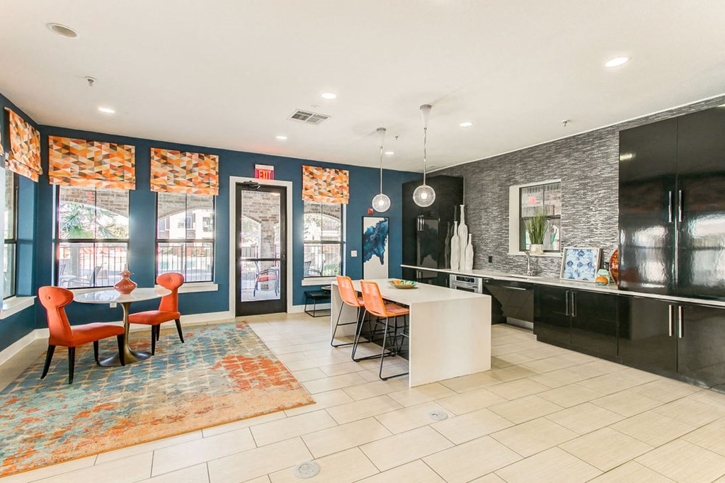 clubhouse kitchen with bar and table seating