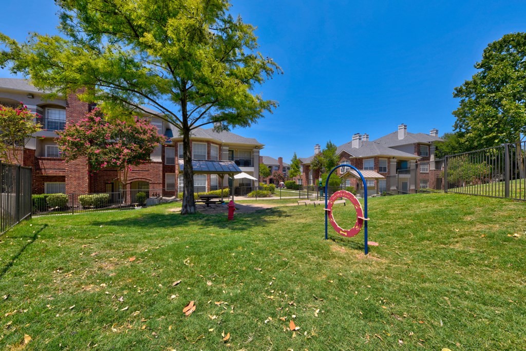 Dog park with gated green grass area