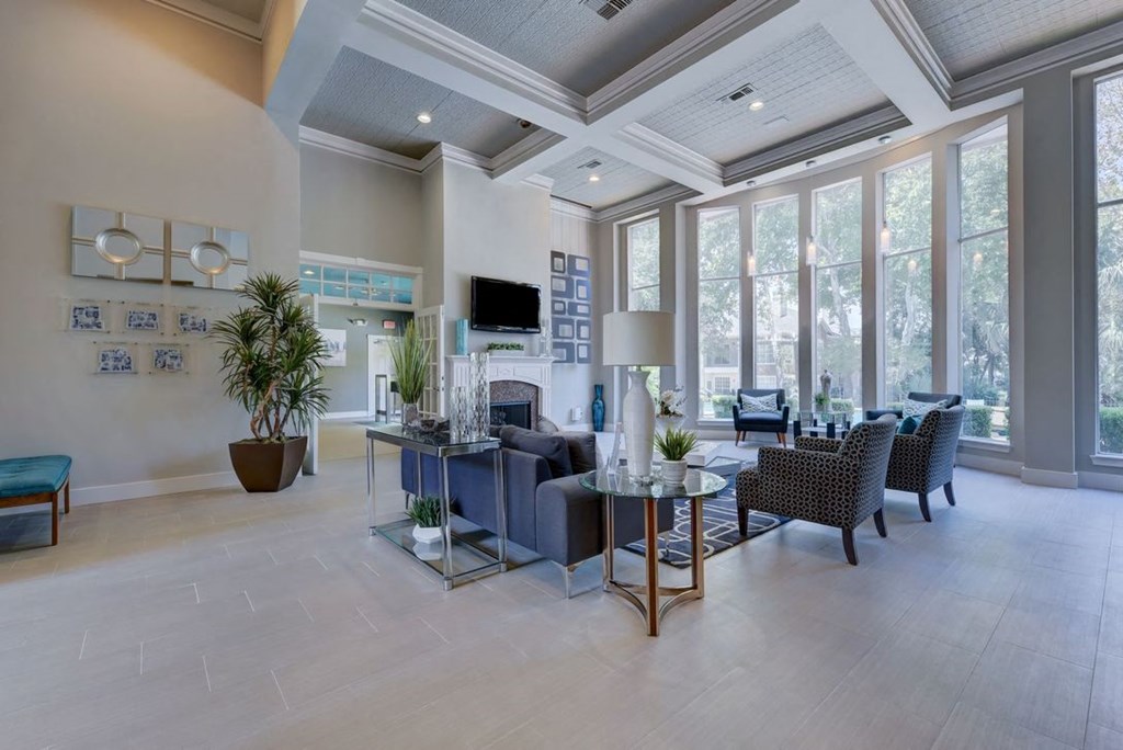 interior of leasing office with large windows and a coffered ceiling