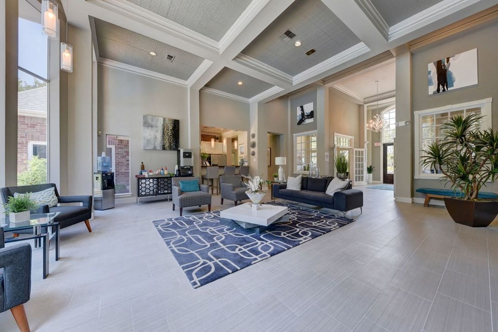 leasing office with gray walls and a coffered ceiling