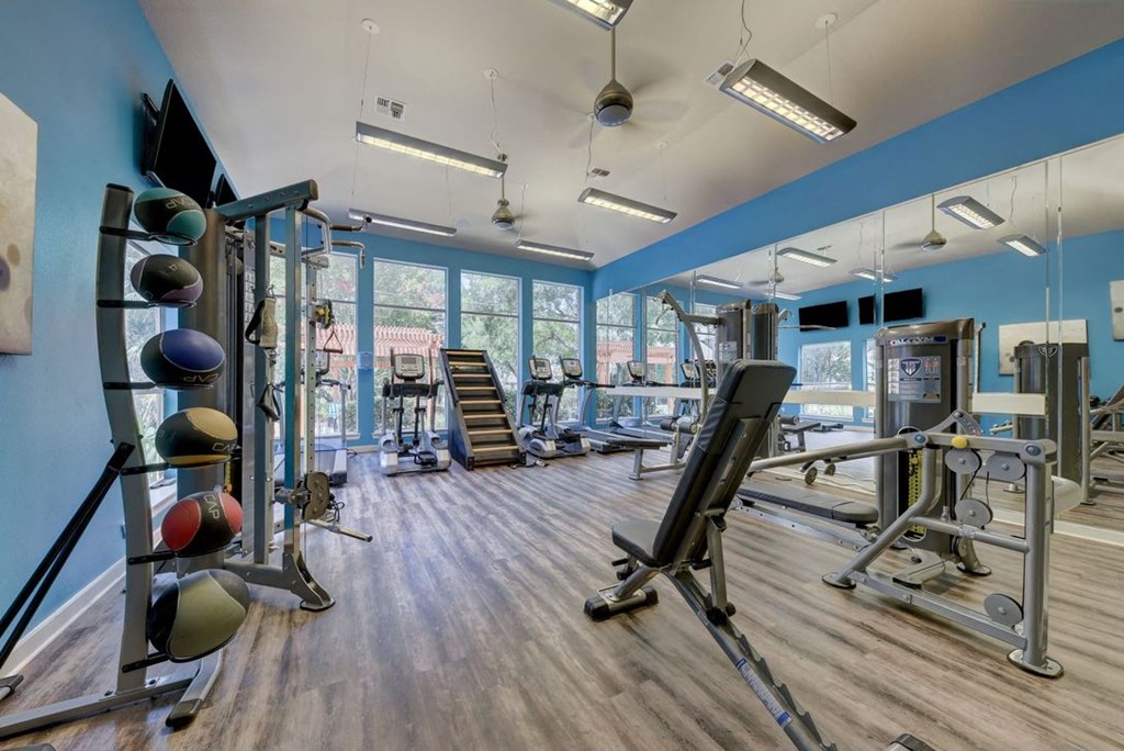 community gym with windows and hardwood floors