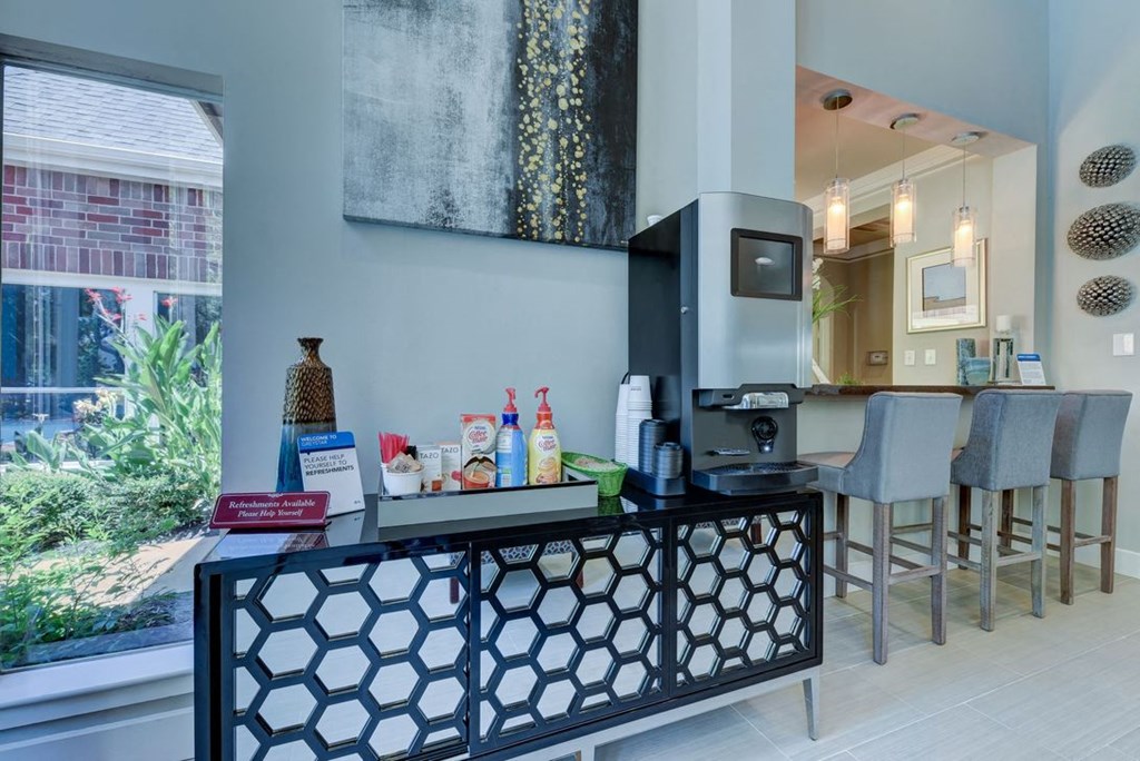 a kitchen with a bar and a large window