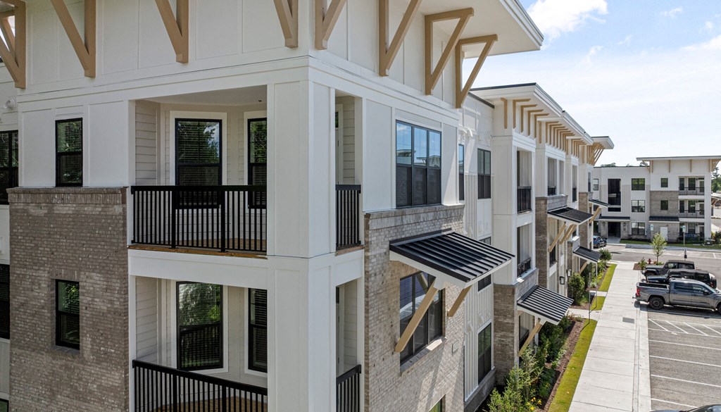 a rendering of a building with balconies overlooking a street