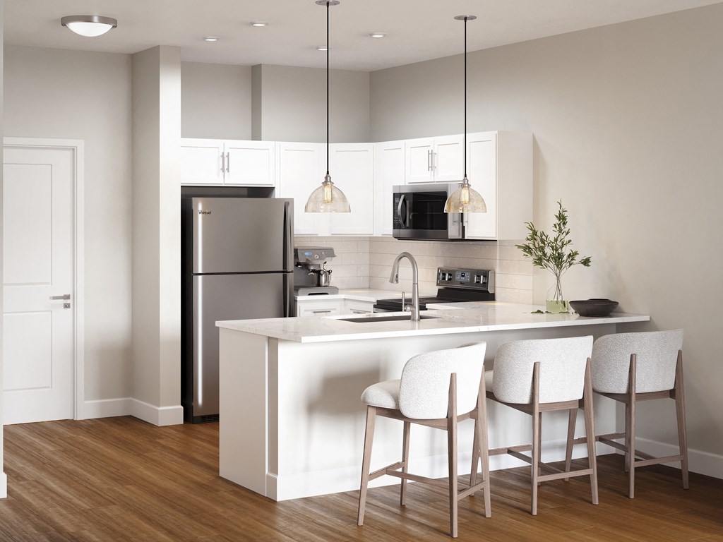 a kitchen with white cabinets and a island with white chairs