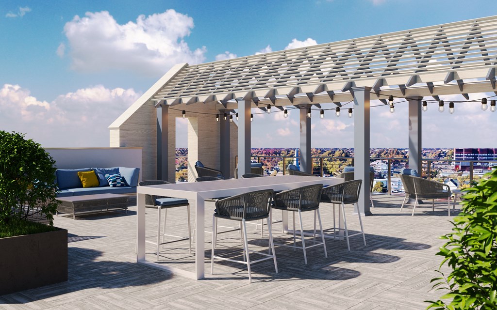 a rendering of a rooftop patio with a table and chairs